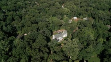 Drone view of american suburb at summertime. Establishing shot of neighborhood. . High quality 4k footage