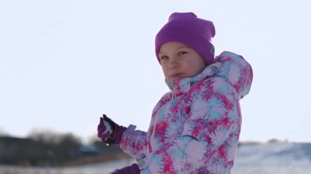 Funny Little Girl Throws Snow Happy Children Play Snowballs High — Stock Video