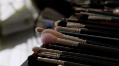 Close up of Professional make up brushes on the table. Move camera. High quality 4k footage