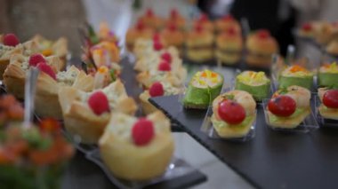 Appetizing and delicious snacks on skewers for guests at the banquet hall. High quality 4k footage