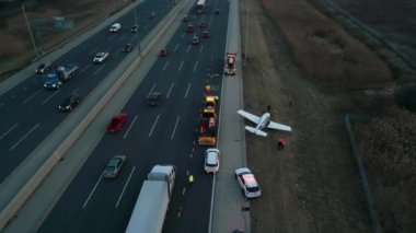 Emergency airplane landing on highway. Drone shot. High quality photo