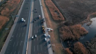 Emergency airplane landing on highway. Drone shot. High quality photo
