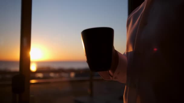 Man Cup Hot Tea Looks Out Window Sun Has Risen — Vídeos de Stock