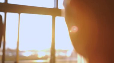 Male hand playing with sunlight glare coming through window. High quality 4k footage