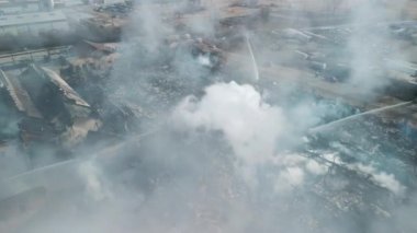 Aerial view of firemen fighting with fire near biulding . High quality 4k footage
