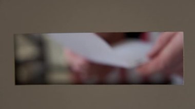 A person casts her ballot during voting for elections at a polling station. High quality 4k footage