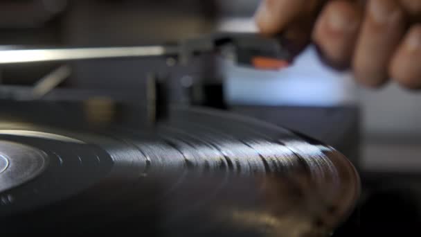 Close Shot Hands Placing Vintage Turntable Spinning Vinyl Record High — Stockvideo