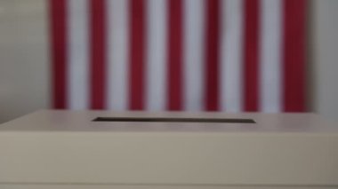 A person casts her ballot during voting for elections at a polling station. High quality 4k footage