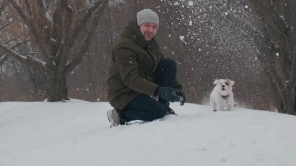 Man Playing Jack Russell Terrier Dog Snow Park Happy Cheerful — Video Stock