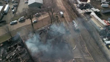 Aerial view of firemen fighting with fire near biulding . High quality 4k footage