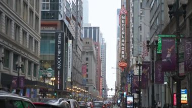 Cars Traffic in Chicago Magnificent Mile street on a Cloudy Winter Day. Vertical shot. CHICAGO, USA - JANUARY 3, 2023 . High quality 4k footage