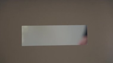 A person casts her ballot during voting for elections at a polling station. High quality 4k footage