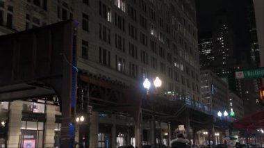 Cars Traffic in Chicago Magnificent Mile street on a Cloudy Winter Day. Vertical shot. CHICAGO, USA - JANUARY 3, 2023 . High quality 4k footage