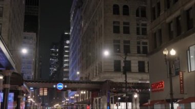 Cars Traffic in Chicago Magnificent Mile street on a Cloudy Winter Day. Vertical shot. CHICAGO, USA - JANUARY 3, 2023 . High quality 4k footage