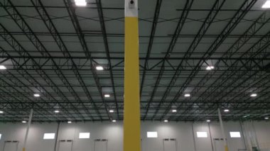 Wide shot of Inside large commercial warehouse. Move camera footage. High quality 4k footage
