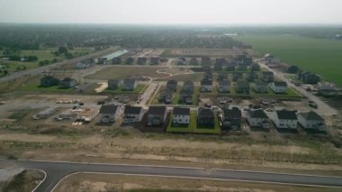 Construction of family houses. Wide aerial shot . High quality 4k footage