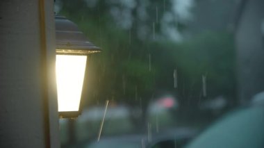 Heavy rain water drops storm rain falls on the lantern. High quality 4k footage