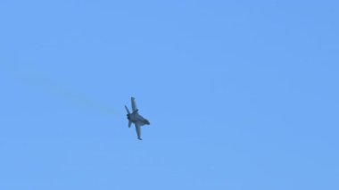 Slow motion view of F-18 fighter jets flying in the sky, showcasing military strength, speed, and precision. High quality 4k footage