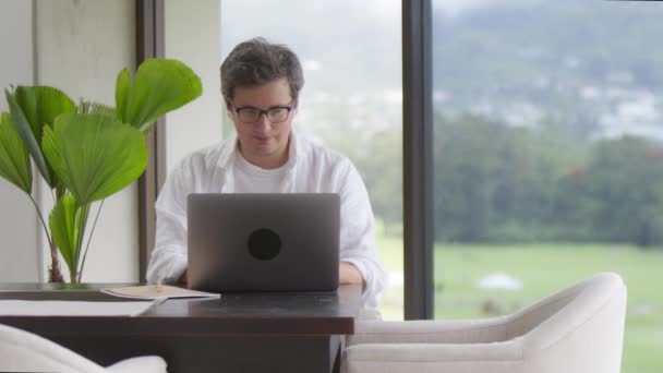 Smiling Handsome Man Eyeglasses Typing Laptop Cozy Elegant Home Living — Stock Video