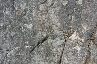 Doğal kaba gri taş dokusunun soyut bir görüntüsü.. 