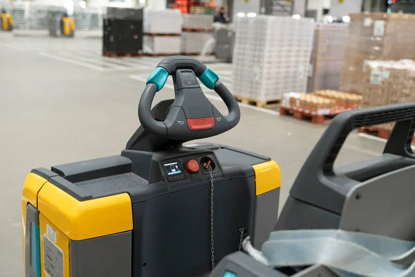 A Steering wheel or gear of a Electric pallet truck or forklift loader or tractor in a distrubution warehouse