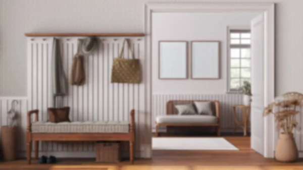 Blurred background, farmhouse hallway and living room with frame mockup. Wooden bench, coat rack and sofa. Parquet floor, vintage interior design