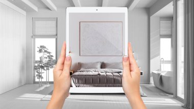 Hands holding tablet showing japandi bedroom, total blank project background, augmented reality concept, application to simulate furniture and interior design products, plan