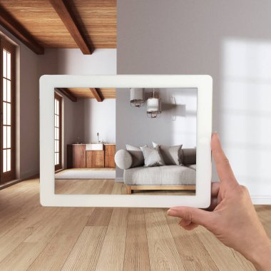 Gelişmiş gerçeklik kavramı. Parke, oturma odası ve mutfak ile boş ahşap iç döşeme mobilya ve tasarım ürünleri simülasyonu için kullanılan AR uygulaması ile el ele tutma tableti