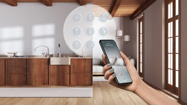 Smart home technology interface on phone app, augmented reality, internet of things, interior design of cozy kitchen with connected objects, woman hand holding remote control device