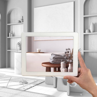 Gelişmiş gerçeklik kavramı. Özel mimari tasarımlı mobilya ürünlerini taklit etmek için kullanılan AR uygulamalı tablet, tamamen beyaz arkaplan, ahşap banyo