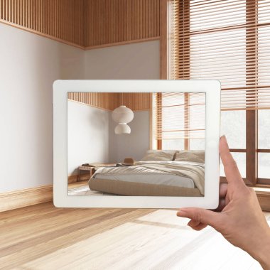 Gelişmiş gerçeklik kavramı. El ele tutuşma tableti ve AR uygulaması parke zeminli, japandi yatak odalı boş iç döşemeli mobilya ve tasarım ürünleri simülasyonunda kullanılır.