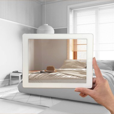 Gelişmiş gerçeklik kavramı. Özel mimari tasarımlı mobilya ürünlerini taklit etmek için kullanılan AR uygulamalı tablet, tamamen beyaz arkaplan, japandi yatak odası