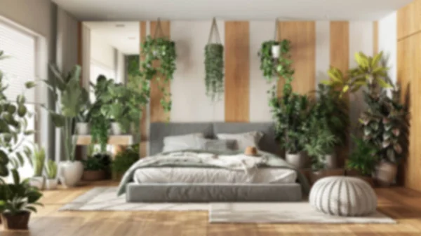 Blurred background, urban jungle, modern bedroom. Master bed, parquet floor and decors, houseplants. Home garden interior design. Love for plants concept