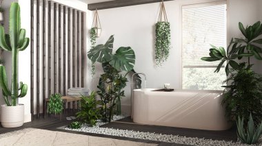 Modern siyah ahşap banyo, beyaz ve bej tonlarda, serbest banyo küveti ve bambu duvarlı. Biyofilik konsept, birçok ev bitkisi. Kentsel orman iç tasarımı