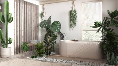 Modern beyazlatılmış ahşap banyo, beyaz ve bej tonlarda, serbest banyo küveti ve bambu duvarlı. Biyofilik konsept, birçok ev bitkisi. Kentsel orman iç tasarımı