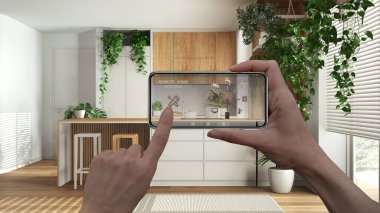 Uygulama simgeleri olan aygıt. Akıllı ev kontrol konsepti, mobil uygulamadan el kontrollü dijital arayüz. Ahşap mutfak ve ev bitkileriyle yemek odası, kentsel orman iç tasarımı.