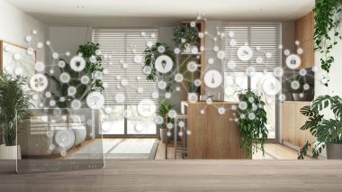 Tablet kablosuz, akıllı ev uygulamalı ahşap masa, bağlantı hattı ve noktalar internet sistemi, ev otomasyon konsepti, adalı beyaz mutfak