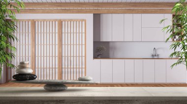 Beyaz minimalist japandi mutfağı, feng shui, zen konsept iç mimari üzerine taş dengesi ve bambu bitkileri ile ahşap vintage masa veya raf