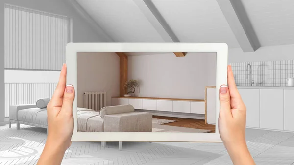 stock image Augmented reality concept. Hand holding tablet with AR application used to simulate furniture and design products in total white unfinished background, japandi minimal living room