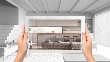 Gelişmiş gerçeklik kavramı. Tamamlanmamış beyaz arka plan, mutfak ve oturma odası gibi mobilya ve tasarım ürünlerini taklit etmek için kullanılan AR uygulamalı el bilgisayarı.