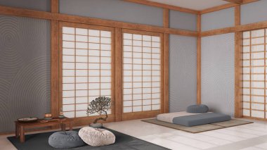 Minimum meditasyon odası, beyaz ve gri tonlarda yastıklar, tatami paspaslar ve kağıt kapılar. Halı, Mala ve dekorlarla dolu bir masa. Japon iç tasarımı