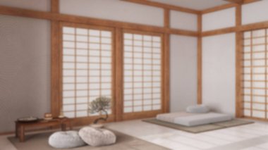 Bulanık arka plan, yastıklı minimal meditasyon odası, tatami paspaslar ve kağıt kapılar. Halı, Mala ve dekorlarla dolu bir masa. Japon iç tasarımı