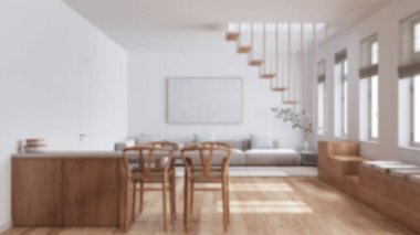 Arka plan bulanık, minimalist İskandinav ahşap mutfak ve oturma odası. Koltuk, asgari merdiven ve sandalyeli yemek adası. İskandinav iç tasarımı