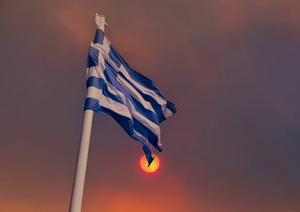 stock image Greek flag on the background of smoke from fires in Greece