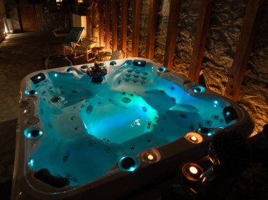 View of the illuminated Jacuzzi at night in Greece clipart