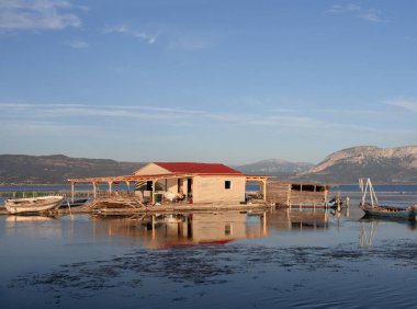 Authentic Fishing houses on the water in the village of Tourlida, Mesolongi, Greece clipart