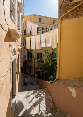 The narrow streets of the Old Town of Kerkyra on the island of Corfu in Greece clipart