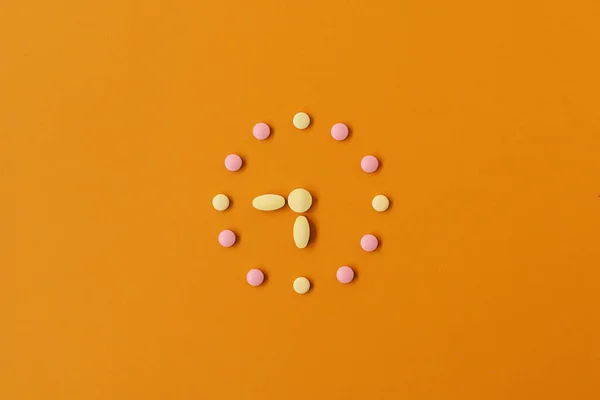 Clock Created Pink Yellow Pills Pastel Orange Background Right Time — Stock Photo, Image