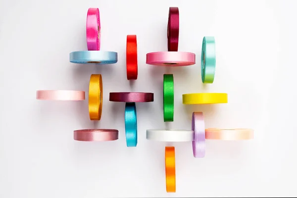 Set Many Colorful Satin Ribbon Spools White Background Textile Ribbon — Stock Photo, Image
