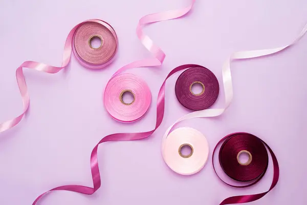 Set Colorful Satin Ribbon Spools Light Purple Background Purple Pink — Stock Photo, Image